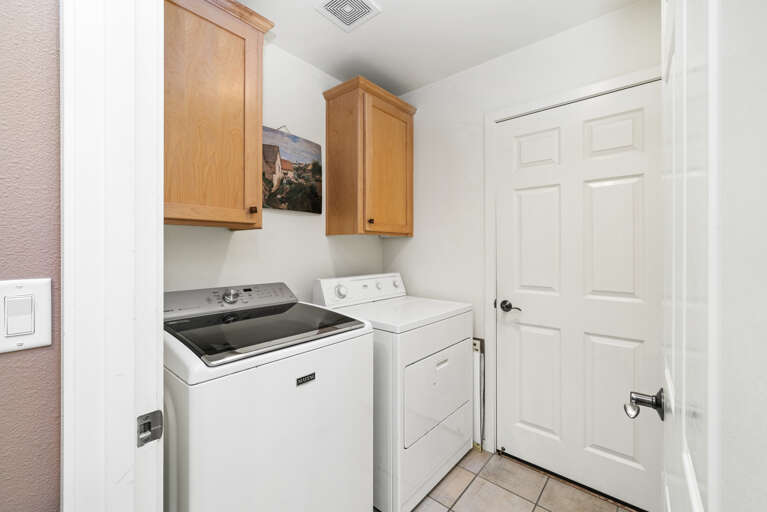 Hall laundry room with Access to garage. 