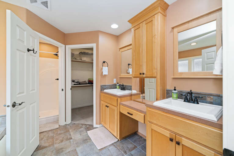 Master bath with jacuzzi tub, walk in shower, large walk in closet and double sinks. 
