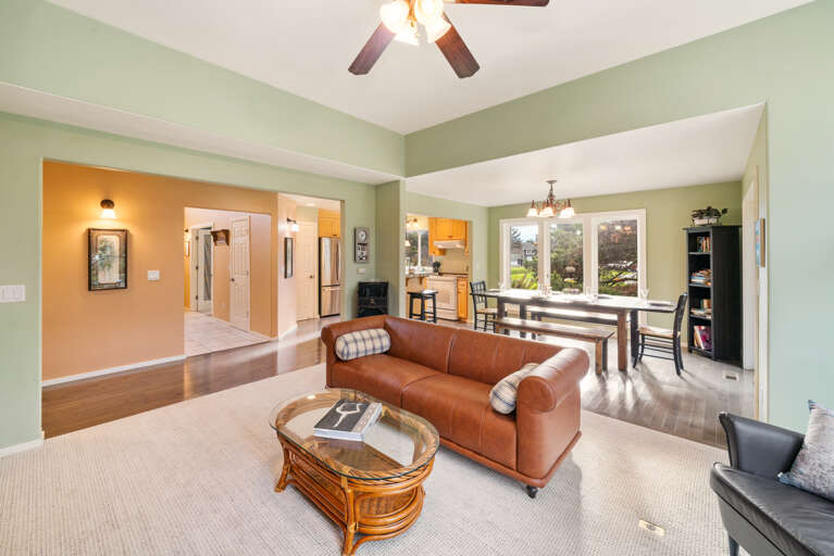 Living room with Smart TV, Wood burning fireplace, and golf course view.