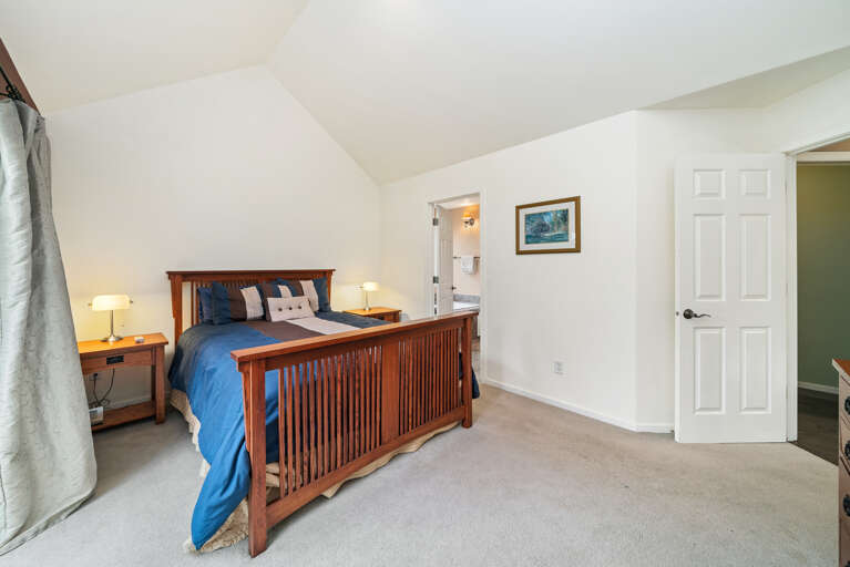 Master bedroom with queen bed, sliding door to back yard, private bath with jacuzzi tub, walk in shower, large walk in closet and double sinks. 