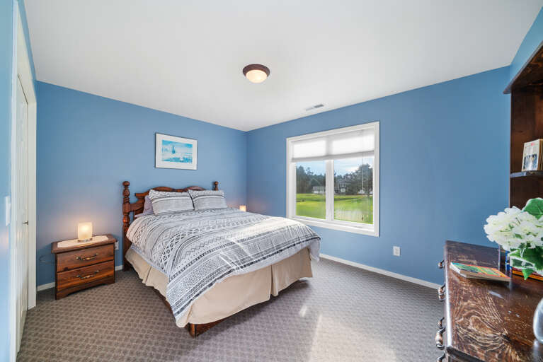 Upstairs queen bedroom with golf course view. 