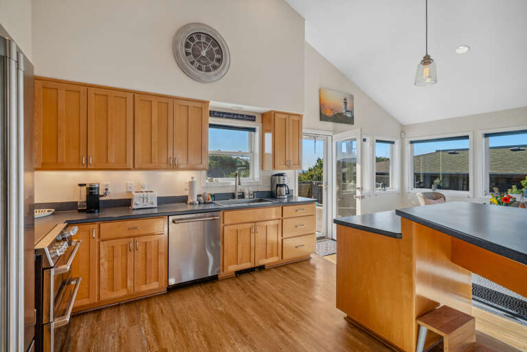 Gourmet kitchen with breakfast bar and ocean view