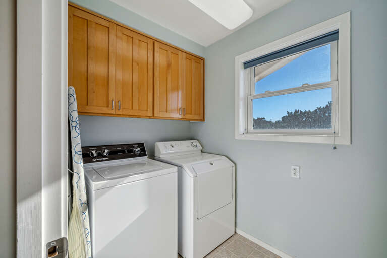 Laundry room with full size washer dryer