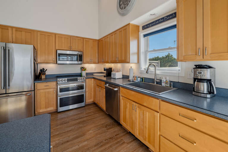 Gourmet kitchen with breakfast bar and ocean view