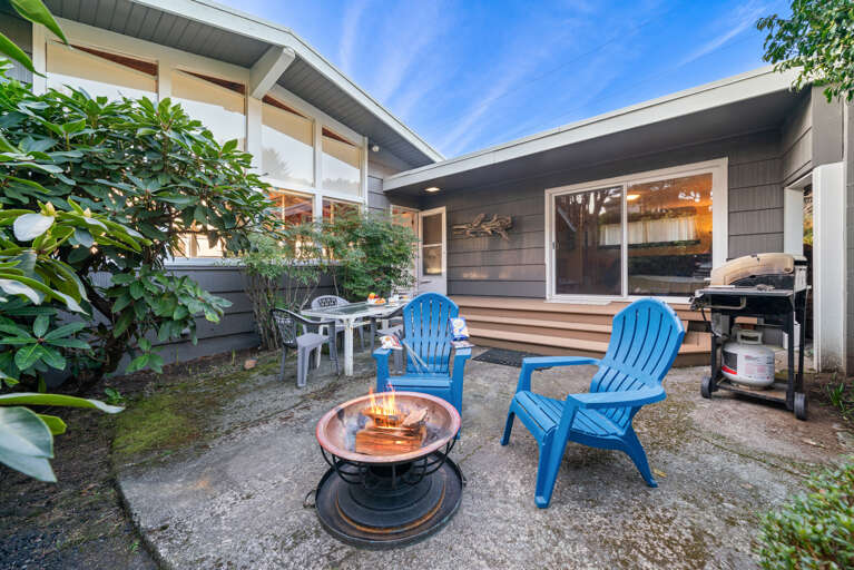 Back yard with creek, firepit, BBQ, dining area Back yard with creek, firepit, BBQ, dining area