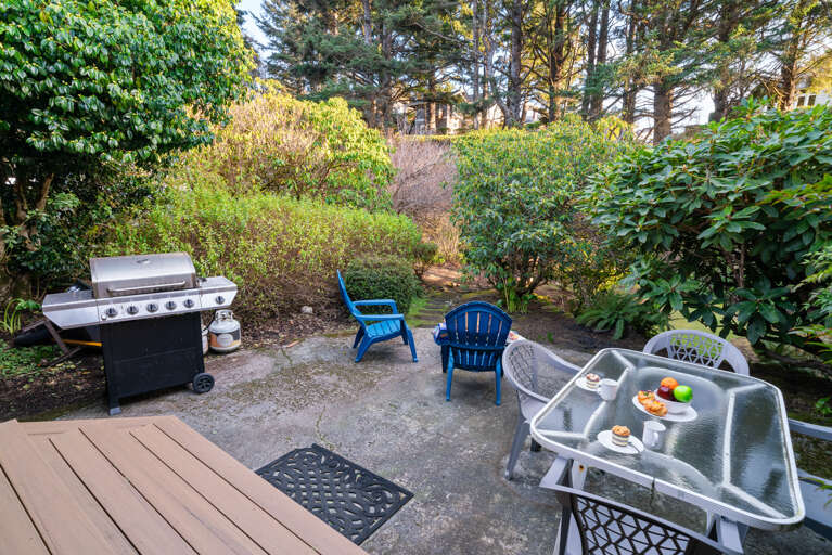 Back yard with creek, firepit, BBQ, dining area Back yard with creek, firepit, BBQ, dining area