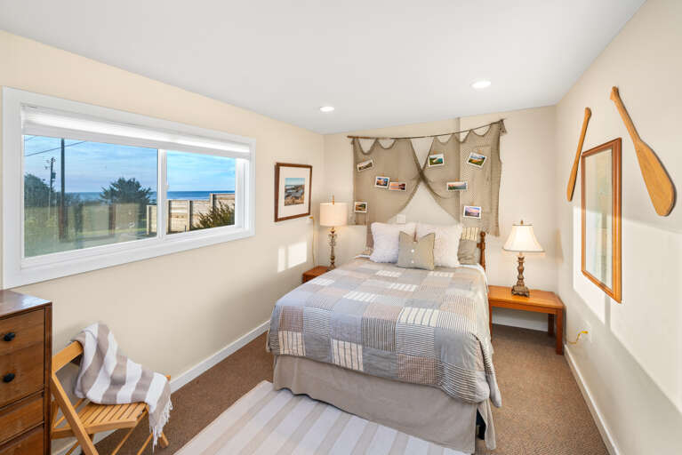 Queen bedroom on the lower level with ocean view.  Queen bedroom on the lower level with ocean view.