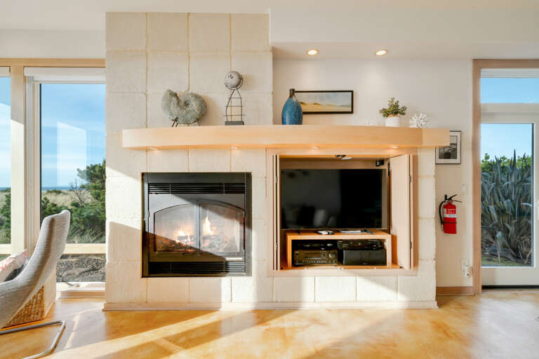 Ocean View living room with gas fireplace, Dish and streaming TV, French doors to outside Ocean View living room with gas fireplace, Dish and streaming TV, French doors to outside