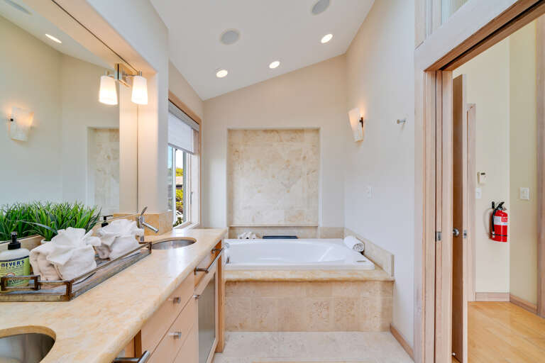 Master bathroom with dual sinks and jacuzzi tub. Master bathroom with dual sinks and jacuzzi tub.