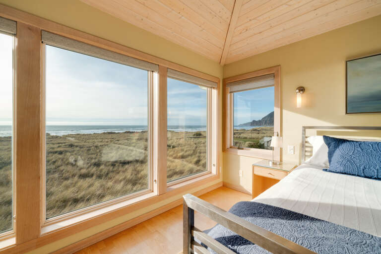 Master bedroom with ocean view, desk work space, gas fireplace, king bed, sitting chair, and TV with Direct TV and streaming.  Master bedroom with ocean view, desk work space, gas fireplace, king bed, sitting chair, and TV with Direct TV and streaming.