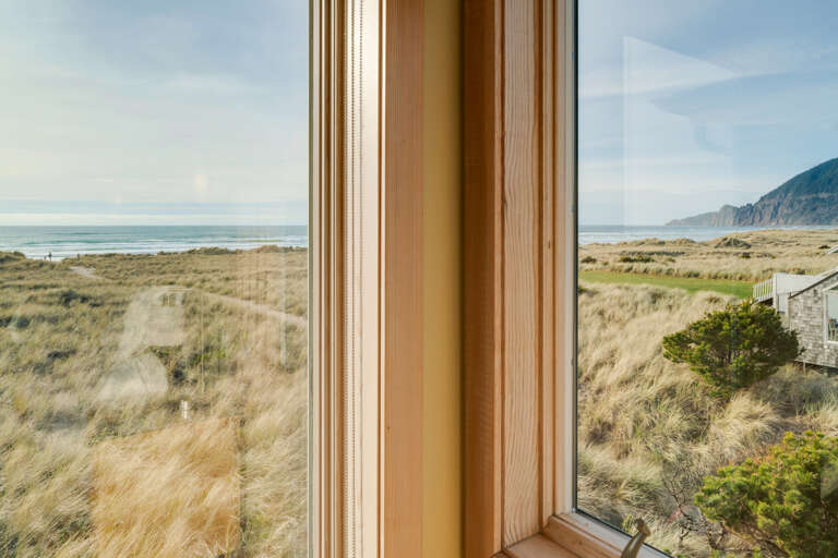 Master bedroom with ocean view, desk work space, gas fireplace, king bed, sitting chair, and TV with Direct TV and streaming.  Master bedroom with ocean view, desk work space, gas fireplace, king bed, sitting chair, and TV with Direct TV and streaming.