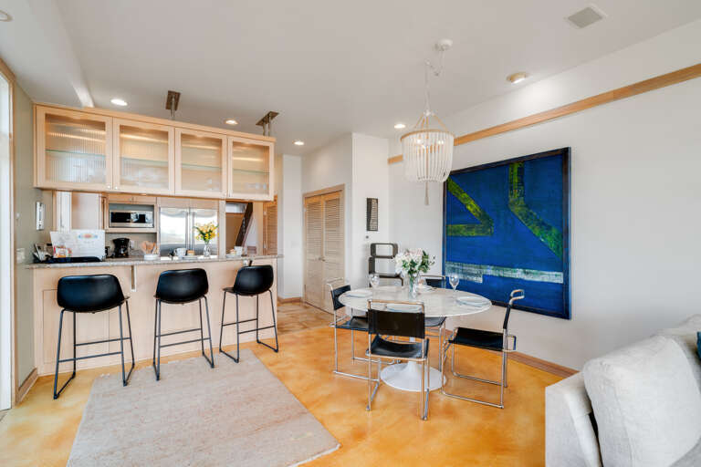 Ocean view dining room open to living room with gas fireplace, Dish and streaming TV, French doors to outside.  Ocean view dining room open to living room with gas fireplace, Dish and streaming TV, French doors to outside.