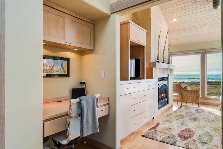 Master bedroom with ocean view, desk work space, gas fireplace, king bed, sitting chair, and TV with Direct TV and streaming.  Master bedroom with ocean view, desk work space, gas fireplace, king bed, sitting chair, and TV with Direct TV and streaming.