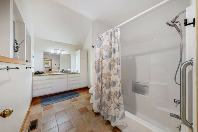 Downstairs bathroom with shower and tub 