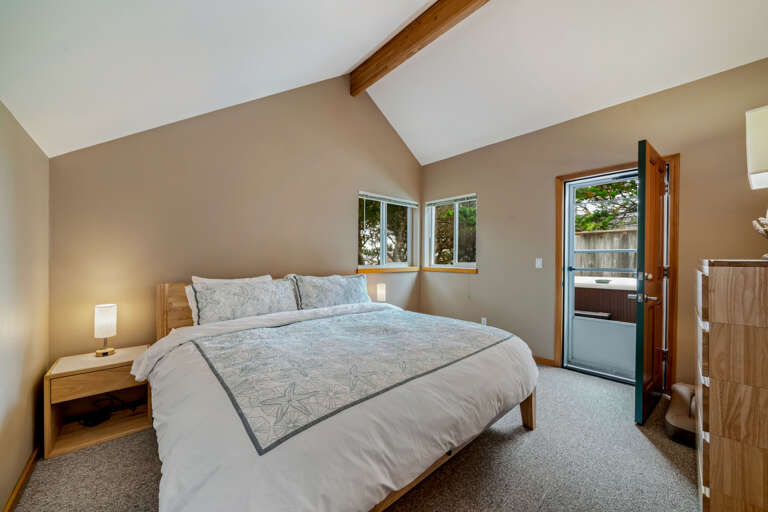 Upstairs King bedroom with access to back deck and hot tub