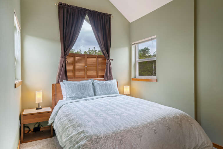 Family bedroom with a queen bed and a twin with twin trundle bed in the alcove room. 