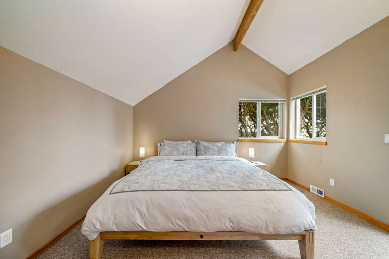 Upstairs bedroom with King bed and deck and hot tub access.