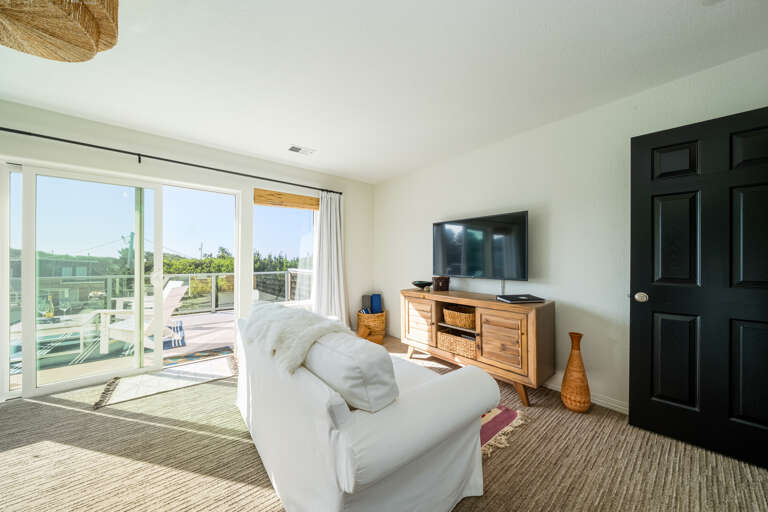 Master bedroom with streaming TV and DVD. Access to large private deck. 