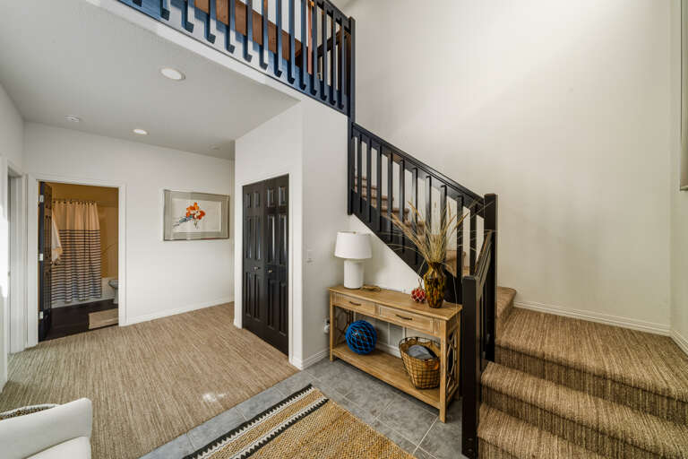 Entry area to the lower floor with 3 bedrooms and full bath. 