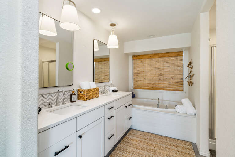 Master bath with jetted tub, walk in shower, private toilet room and walk in closet. 