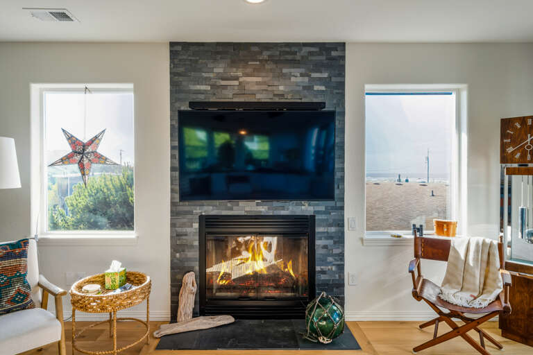Ocean views from the open living space with streaming TV and gas fireplace 