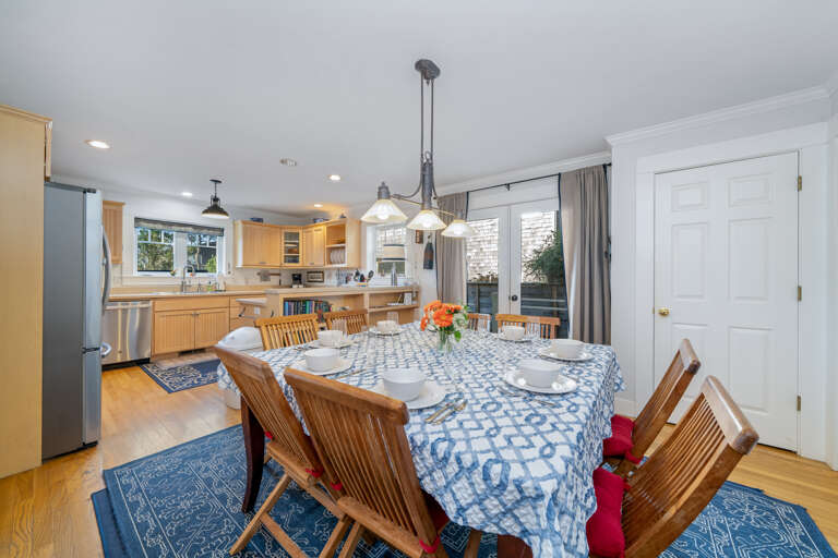 Dining room with large table with extra chairs available. 