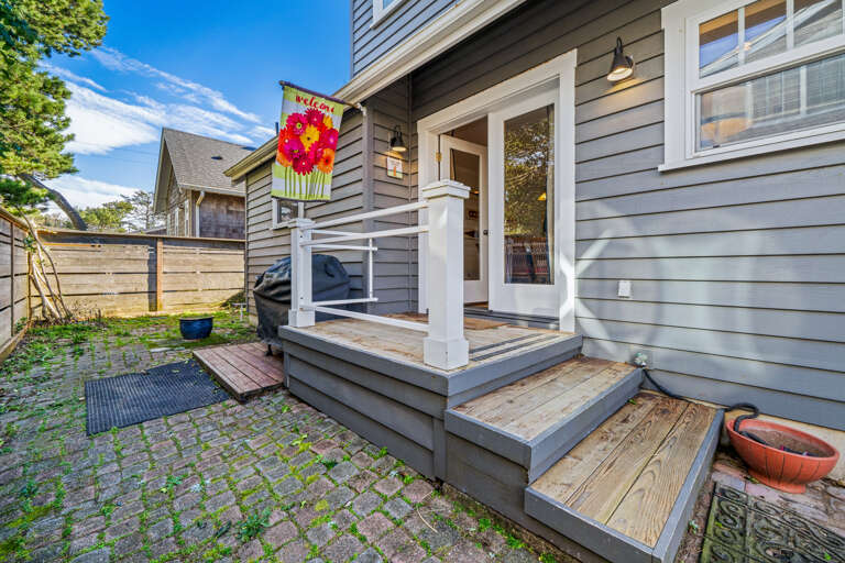 Back yard area with BBQ, picnic table, Outdoor shower