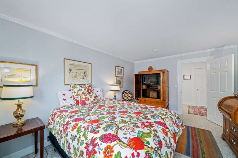3rd queen upstairs bedroom with desk, streaming TV, and large closet