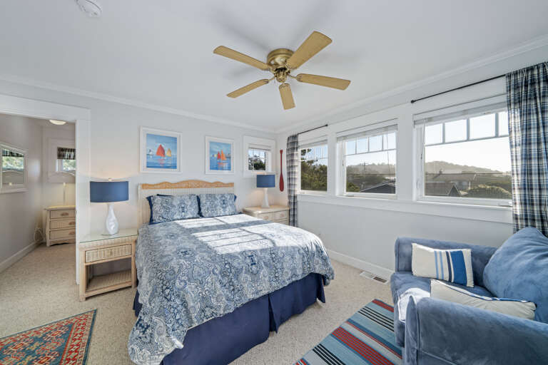 Upstairs queen room with large closet and comfy large club chair