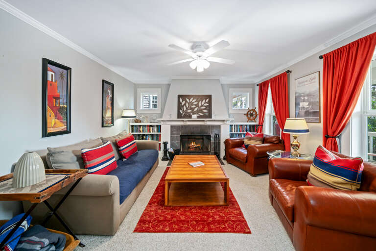 Den with fireplace and large relaxing club chairs