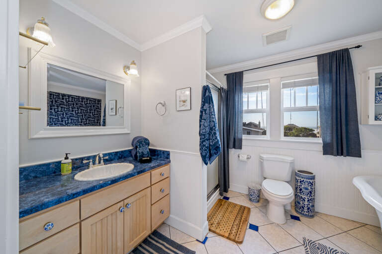 Upstairs hall bath with large jetted tub and walk in shower. 