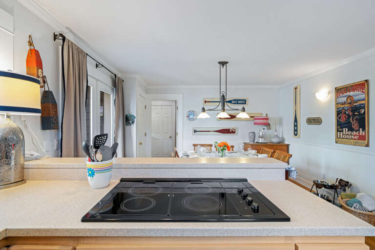 Jenn-Air stove, double oven, dishwasher, fridge, and open to the dining room