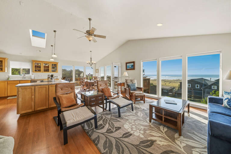 The living room is open to the kitchen with breakfast bar, food prep area with extra utility sink. 