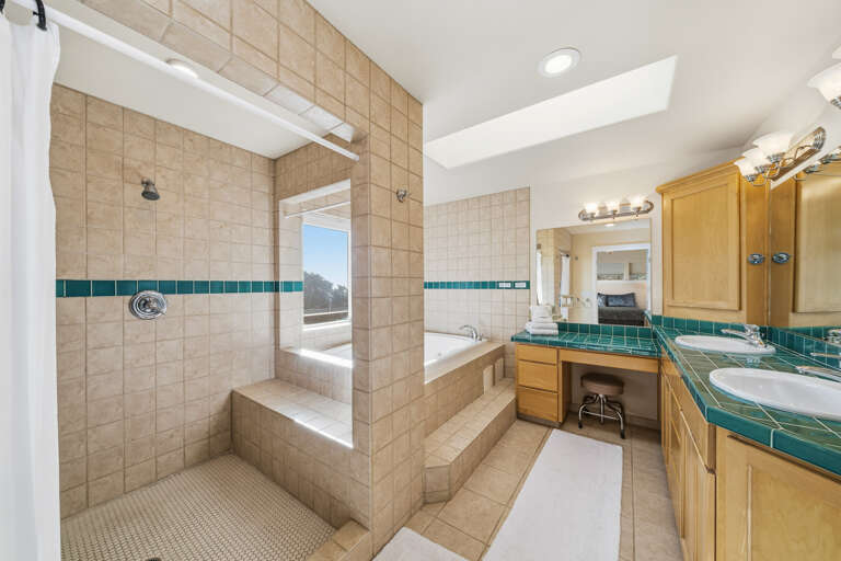 Jacuzzi tub in the master bath with the walk in shower. 