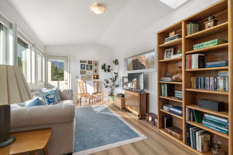 Upstairs family room with streaming tv, DVD player, video library and book library with access to the upper deck