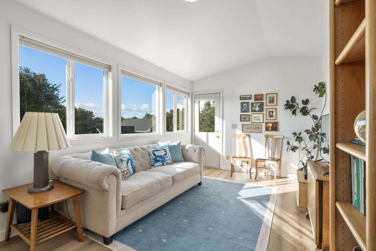 2nd story family room with bright natural light. Relax and read or stream on the streaming tv or watch one of the many DVD