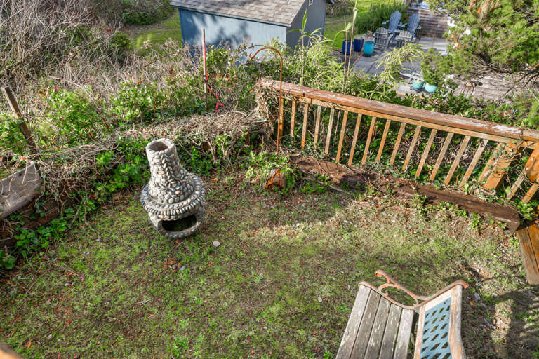 Outdoor back yard with bench and chimenea for smores