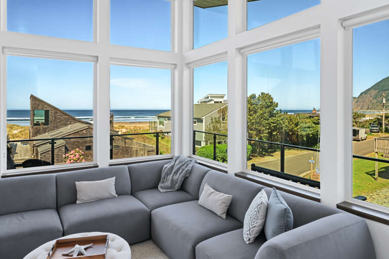 large picture windows in living room with ocean views