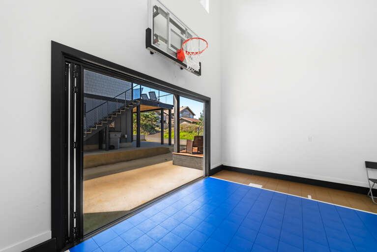 Basketball court with sliding window wall. 