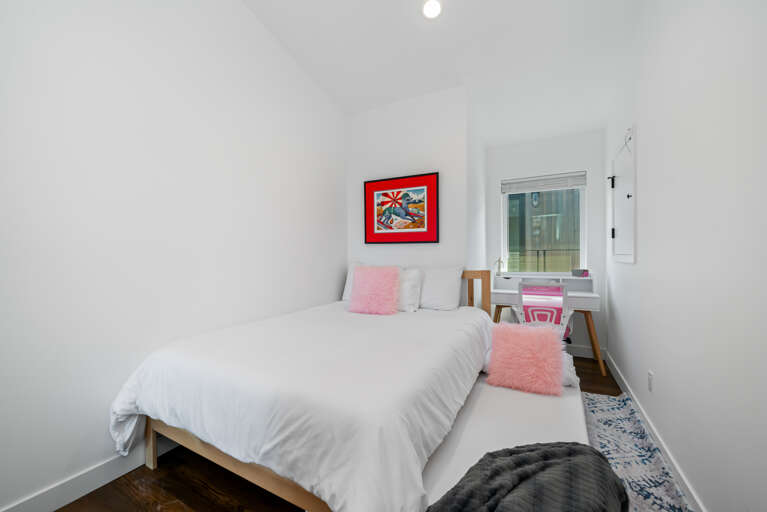 2nd bedroom with double bed with twin trundle