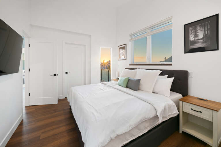 Master bedroom with streaming TV, private bath and access to the deck. 