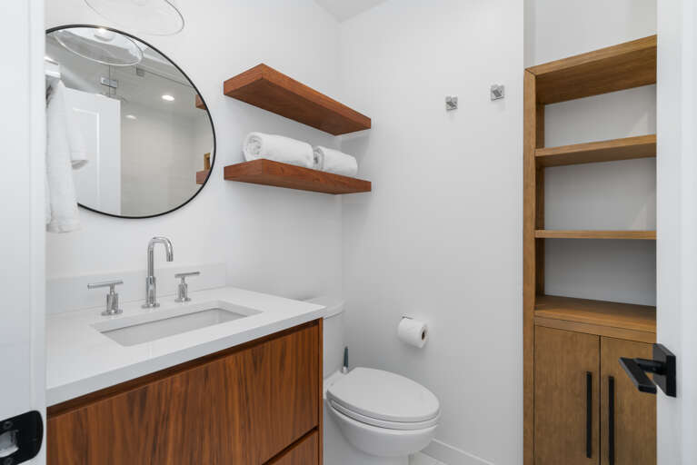 Hallway bathroom with steam shower