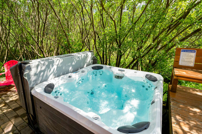 Hot tub on back patio with large deck and Gas BBQ. 