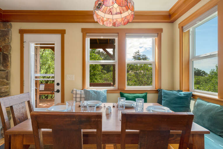 Family style sitting at the dining table with bench seating. 