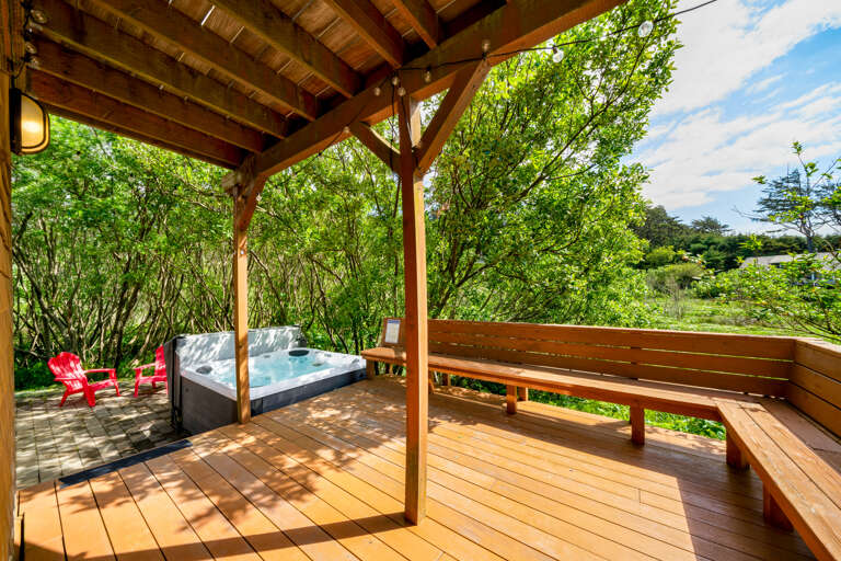 Large outdoor deck area with hot tub, Gas BBq, and patio 
