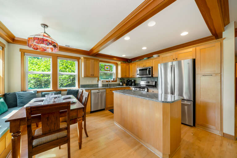 Open kitchen and dining area with fully equipped kitchen. 