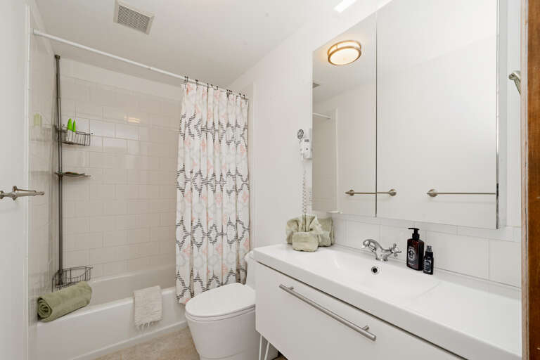 Downstairs bathroom with tub/shower combination