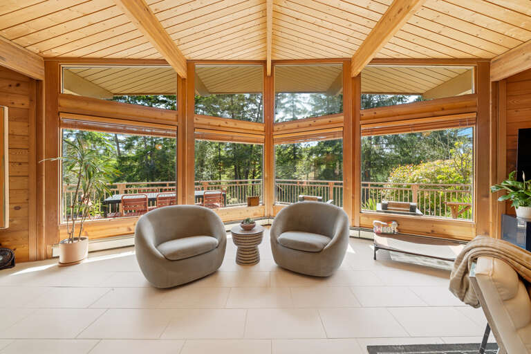 Open living room with large comfy couch, Smart TV, Dining area, and open to the Kitchen. 