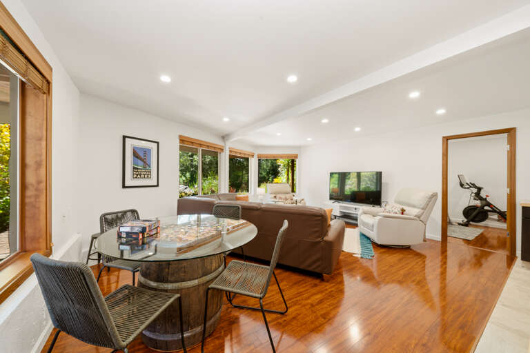 Downstairs living area with dining table and kitchen
