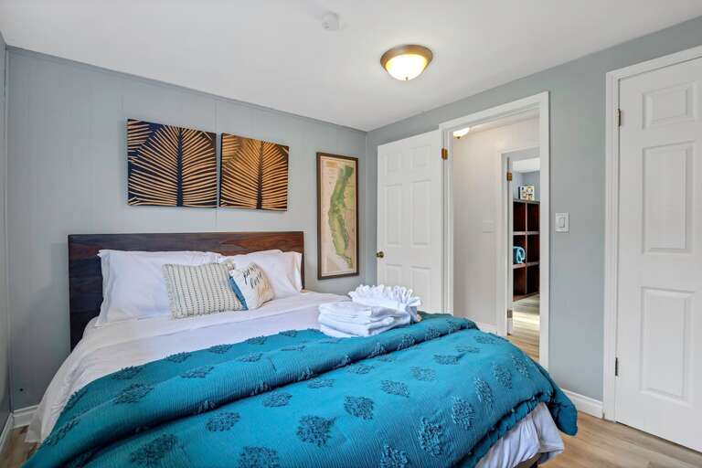 Bedroom 5 has a comfy queen sized bed and is downstairs at the end of the hallway on the right. Bedroom 5 has a comfy queen sized bed and is downstairs at the end of the hallway on the right.